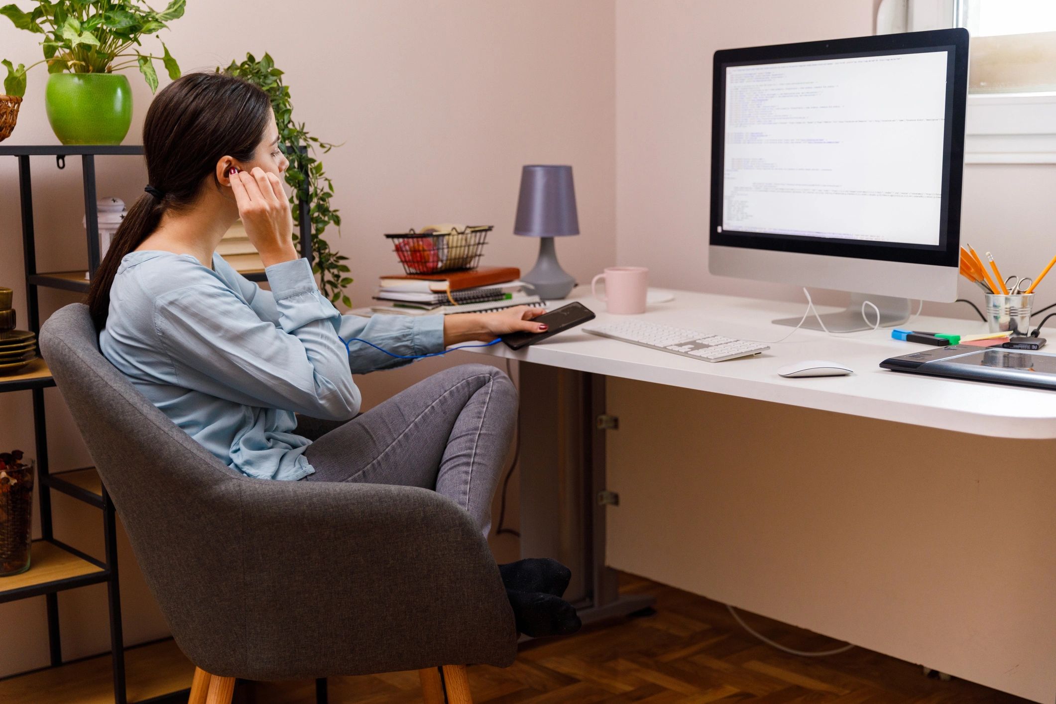 Creative professional listening to music while working