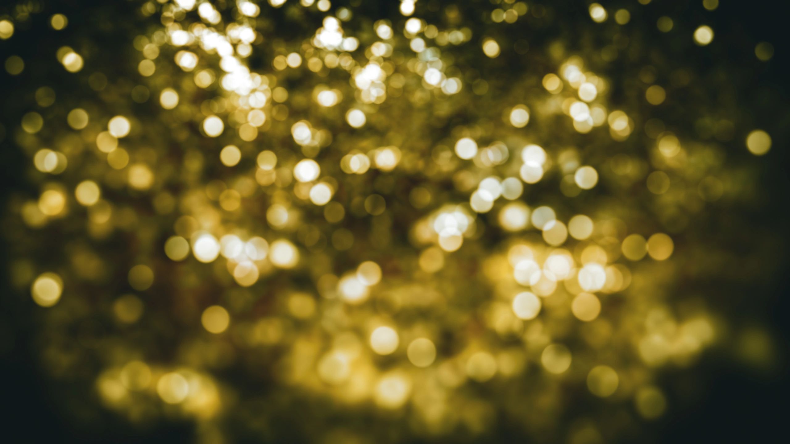 Sparkling golden holiday bokeh background
