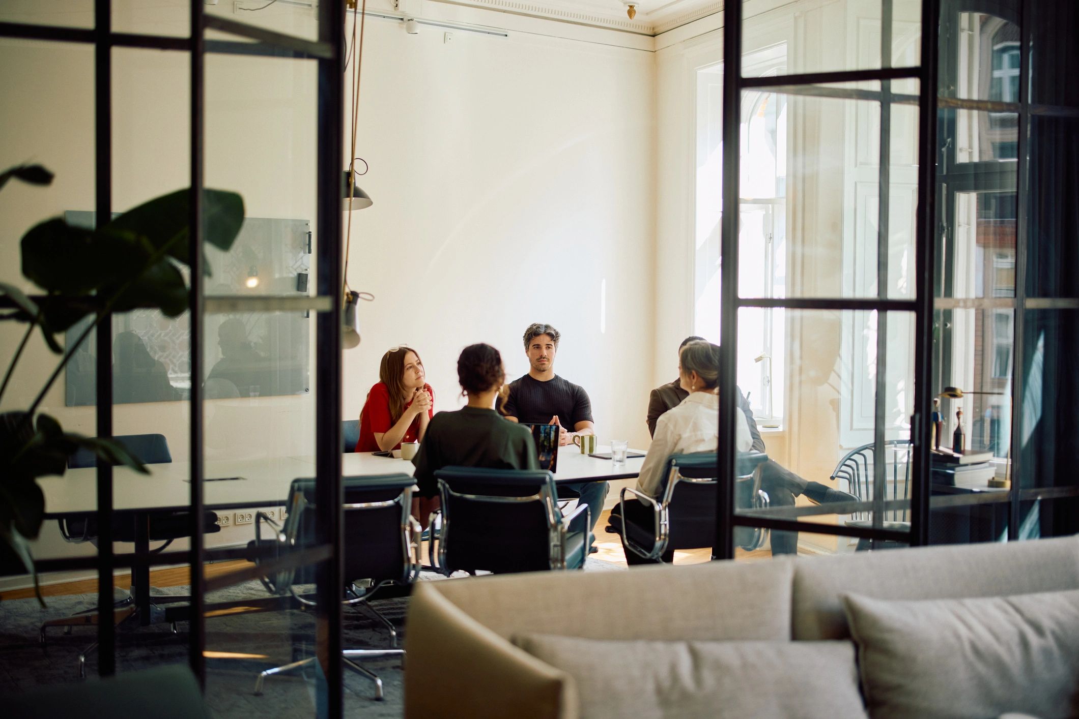 Business professionals collaborating in a bright creative office