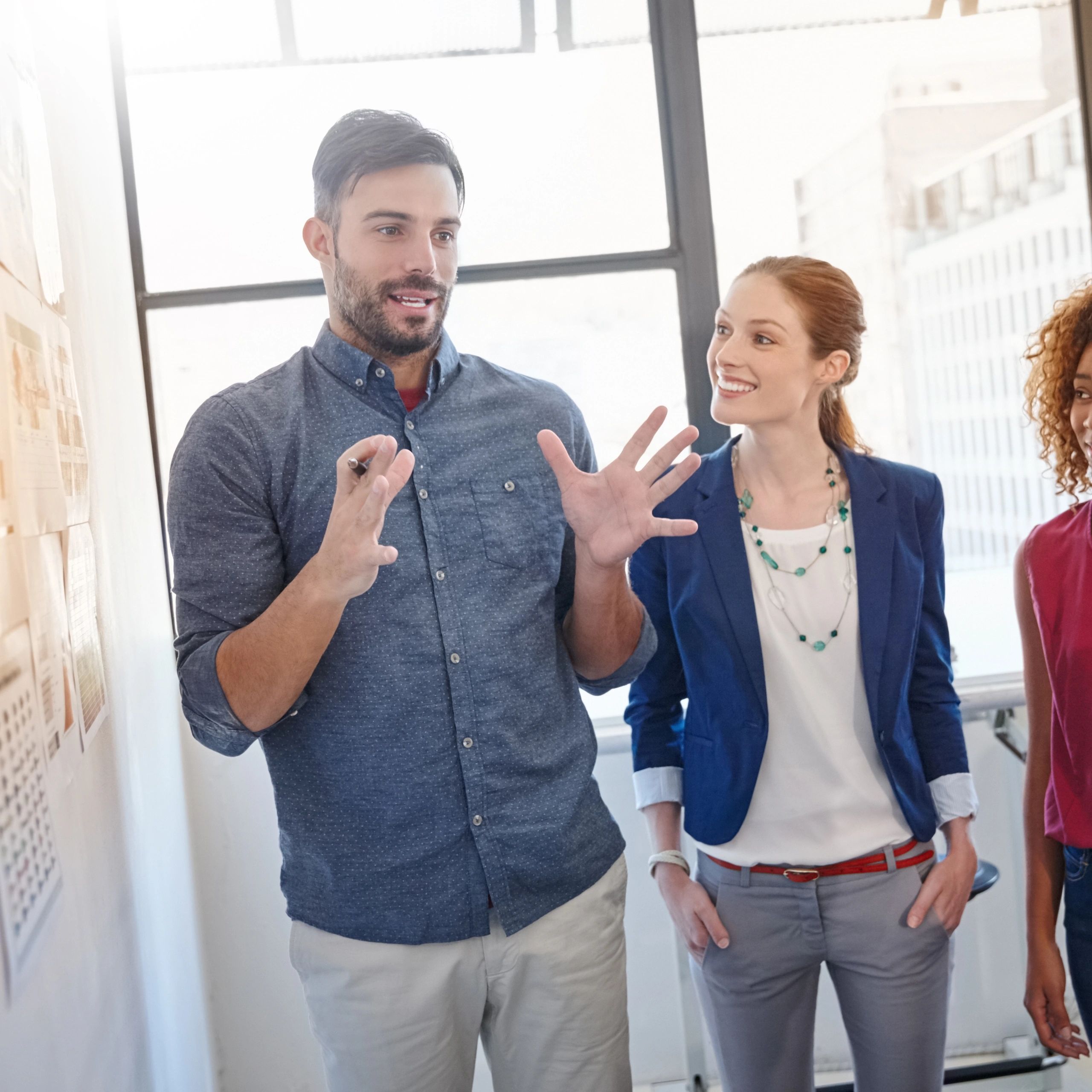 Group of businesspeople listening to a colleague presentation